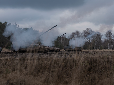 multiple Panzerhouwitser / Panzerhaubitze / armoured howitzer / PzH 2000 NL in firing position during military exercise