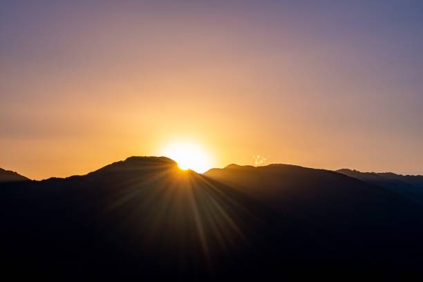 istock Silhouette of mountains with the setting sun 1475911270