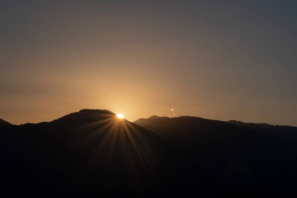 istock Silhouette of mountains with the setting sun 1475911390