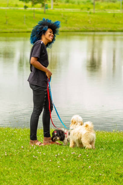 istock A young woman and her dogs. 1475913992