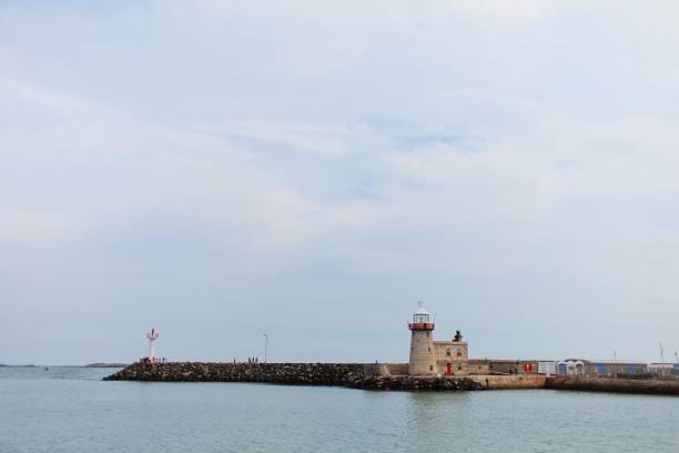 istock Howth Lighthouse. Harbor and marina in cloudy day in Howth, Dublin, Ireland. 1475914929