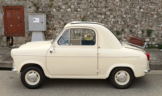 Percoto, Italy. March 19, 2023. Piaggio Vespa 400, vintage microcar produced by french automaker Acma, during an old timer car gathering.