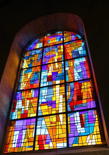 Stained glass Ten Commandments in church.