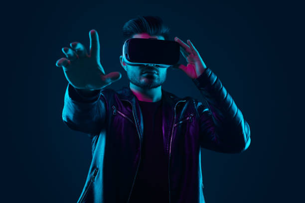 istock Man in VR glasses interacting with virtual world 1475933332