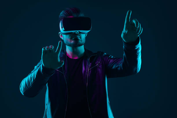 istock Man in VR headset interacting with virtual world 1475933336