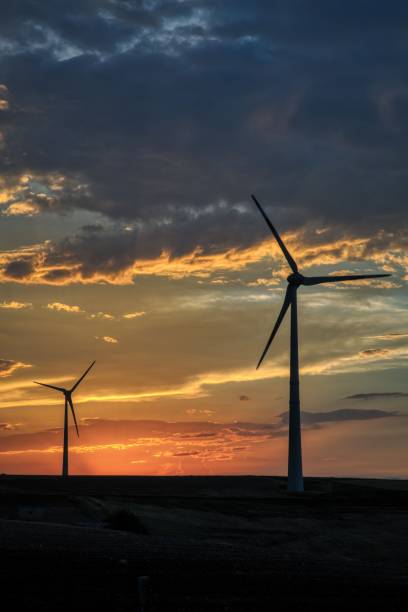 istock Countryside landscape at sunset with wind turbines in operation 1475937024