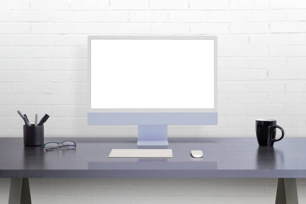 istock Modern computer display on office desk. Isolated screen for web page mockup promotion 1475940639
