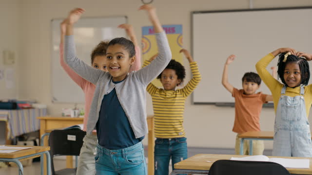 Kids, dance and education with students in class, having fun or learning a routine for dancing performance. Children, kindergarten or school with girl and boy pupils in a classroom as dancer learners