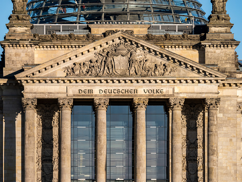 The Reichstag building seen from the former Königsplatz at sunrise in Berlin, Germany.