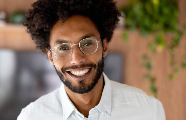 istock Happy man smiling at home 1475954408