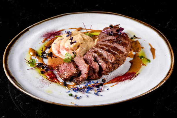 istock Roasted Duck breast fillets with vegetable pure in plate 1475955529