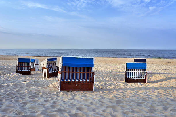 Sunbathing baskets on a sandy beach by the Baltic Sea in Germany