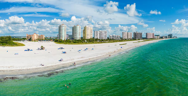 Aerial view of the nearly empty Sand Key Beach at the island Sand Key in Clearwater, Florida
