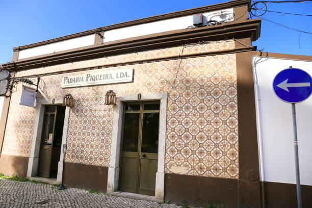 Alcochete, Lisbon, Portugal- October 21, 2022: Old and vintage bakery facade with beautiful tiles in Alcochete town