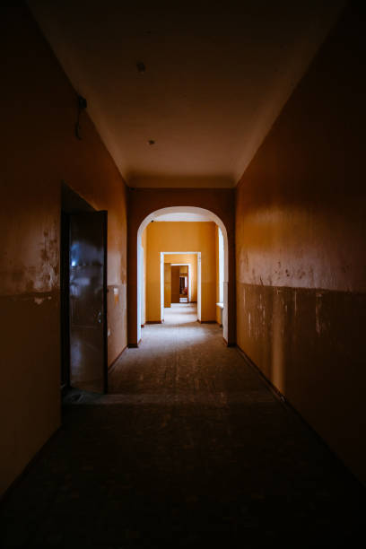 istock Dark creepy corridor of abandoned building 1475976014