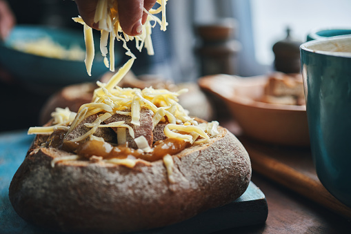 Preparing French Onion Bread Bowl with Gruyere