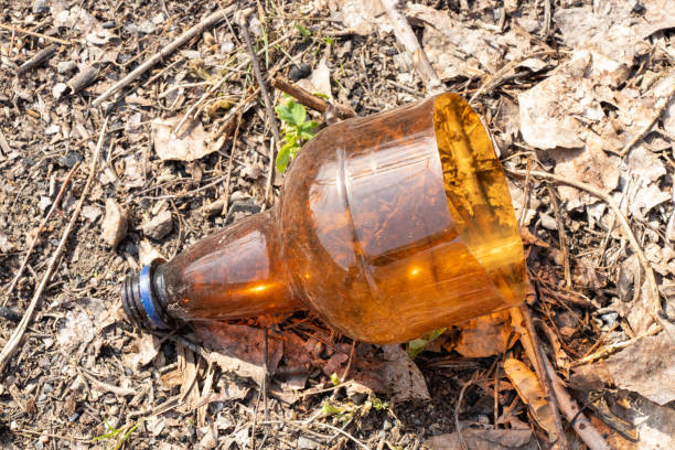 istock a plastic bottle lies on grass in nature thrown away like garbage 1475986595