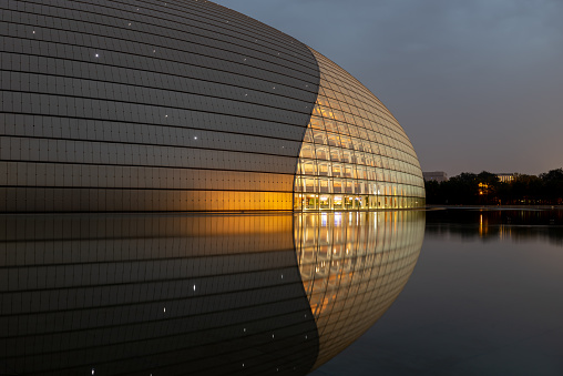 Beijing, China , June 06 2018: Night view of National Centre for the Performing Arts NCPA, described as The Giant Egg, under the moonlight Beijing, China.