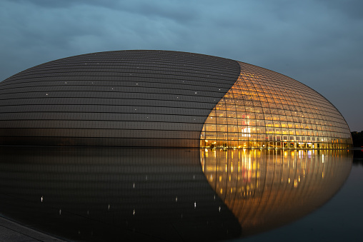 Beijing, China , June 06 2018: Night view of National Centre for the Performing Arts NCPA, described as The Giant Egg, under the moonlight Beijing, China.