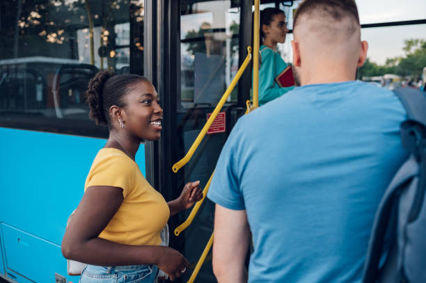 istock Multiracial friends entering the bus together 1475989477