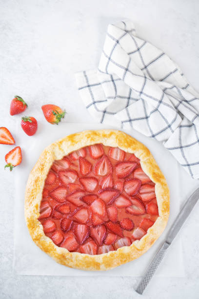 istock Strawberry galette on a paper sheet 1475989784