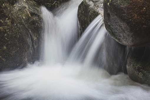 beautiful waterfalls on slopes of mountains