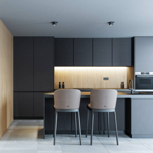 istock Modern minimalist kitchen with long island with stools. Oak wood and dark cabinets. 1475994736