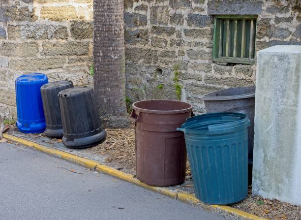 istock Trash cans on sidewalk in front of old brick wall in Saint Augustine Florida 1475996585