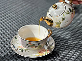 istock Tea being poured into a cup 1475996630