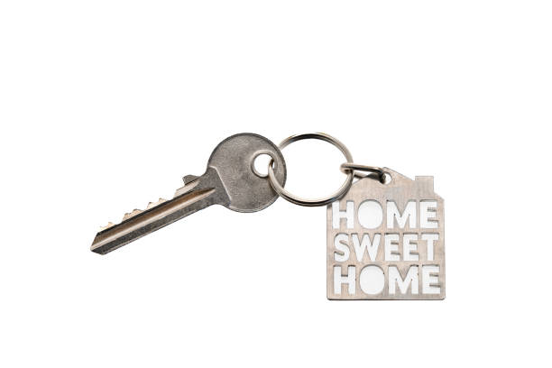 House key and a Home Sweet Home key chain - white background
