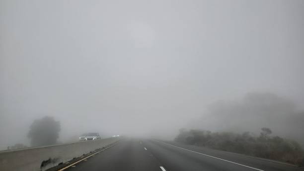 istock Driving highway in fog 1475999956