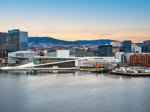 Oslo city buildings from the seaside during sunset in Norway