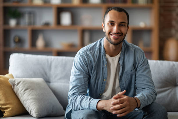 istock Portrait Of Handsome Young Black Man Posing In Home Interior 1476001440