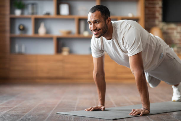 istock Active Sporty Black Male Training At Home, Making Plank Exercise 1476002153