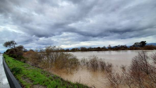 istock Storm clouds and flooded area 1476004137