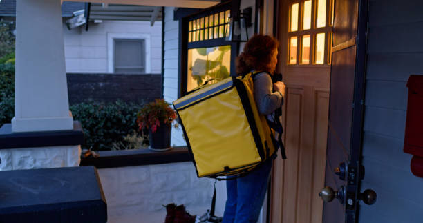 istock Delivery Person Waiting Outside a Home 1476004232