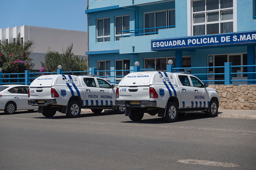 Sousse, Tunisia - September 12, 2012: A policeman checking a driver in the car parked on the side of the road by Port El Kantaoui, the tourist complex near Sousse, Tunisia.