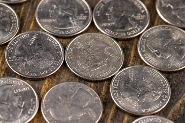 istock old American quarter dollar coins, close-up 1476012292