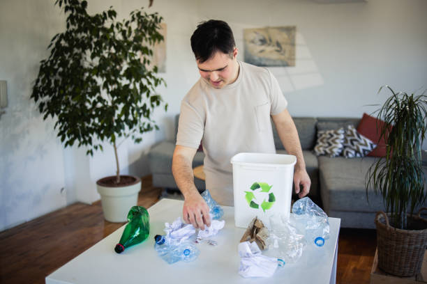 istock Young man recycling plastic waste at home 1476012983