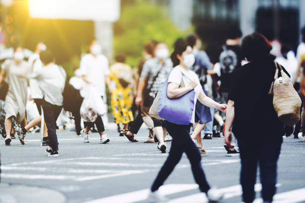 istock Many people crossing Osaka in Japan 1476013531