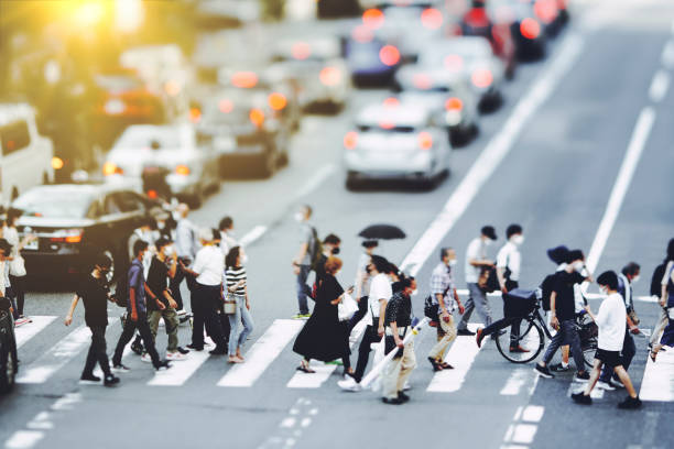 istock Many people walking in the downtown area 1476013755