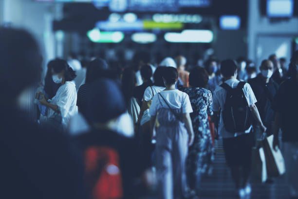istock Many people walking in the downtown area 1476013794