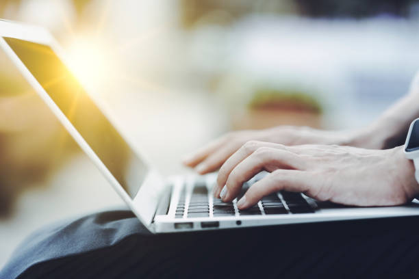 istock Close-up photo of a person's hand using a laptop 1476016690