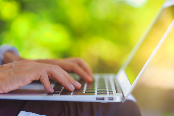 istock Close-up photo of a person's hand using a laptop 1476016727