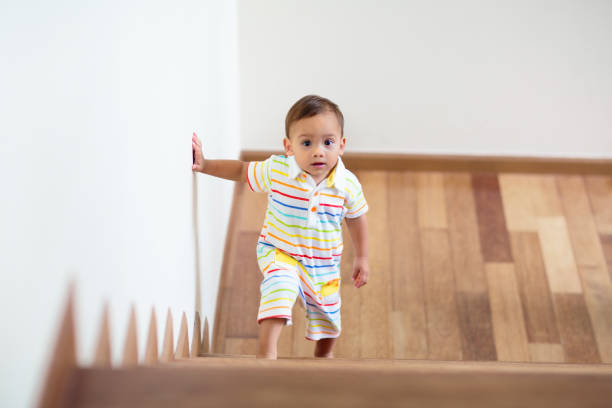 istock Kids on stairs. Child moving into new home. 1476017926