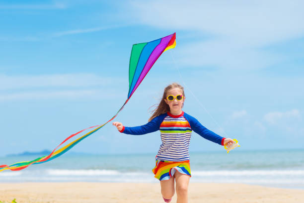 istock Child with kite. Kids play. Family beach vacation. 1476018021