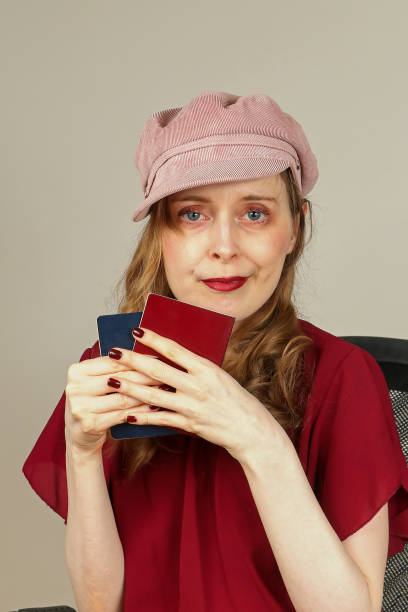 istock Woman holding passports 1476018096