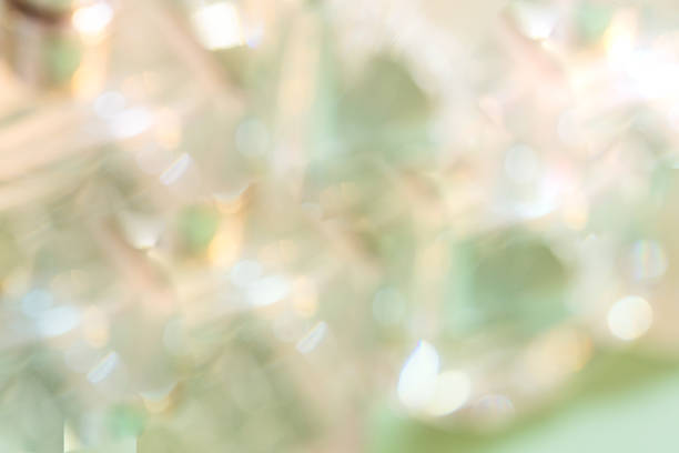 istock Blurred defocused luxery perfume bottlles for abstract beauty background with bokeh in beihe green tone.Copy space 1476022011