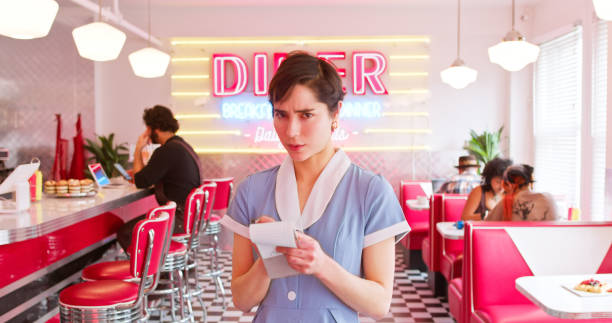 Vintage style waitress or female server with serving platter 