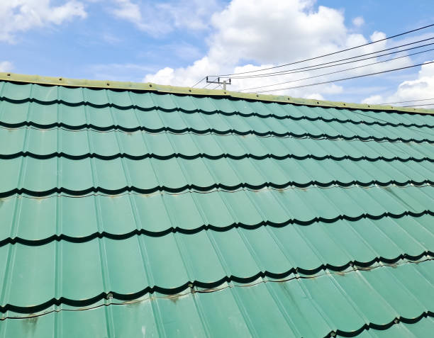istock new green tin roof with sky background 1476025384